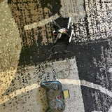 Blue and gray quadcopter drone with camera and visible propellers