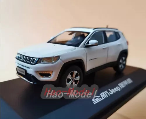 White alloy diecast SUV model car with front grille and headlights detail