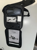 Black drone carrying case, open with folded drone and controller compartments