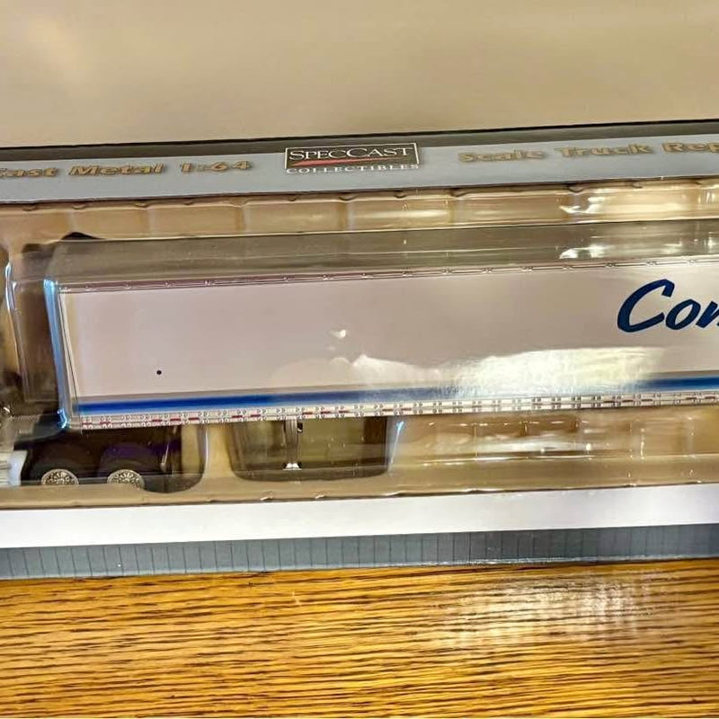 Diecast Con-Way tractor trailer replica, white trailer with blue logo, in display box