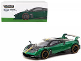 Diecast model car in green and black with black wheels and clear headlights