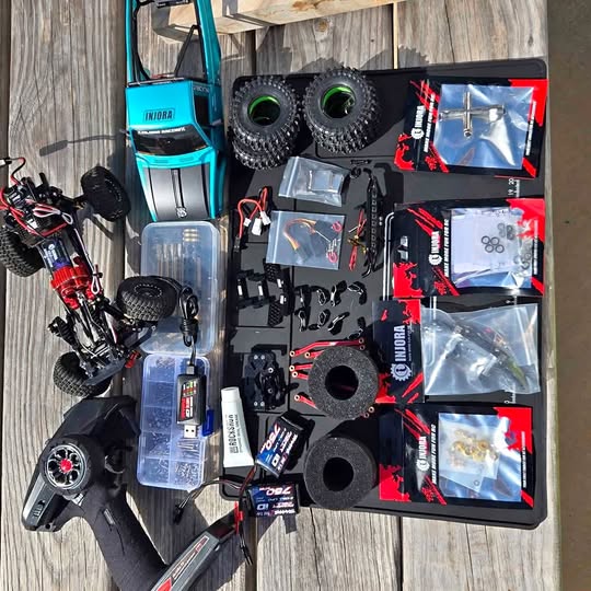 Drone parts kit with propellers and electronics accessories in organizer case