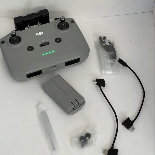 DJI Mini 2 drone controller with cables and battery accessories