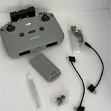 DJI Mini 2 drone controller with cables and battery accessories