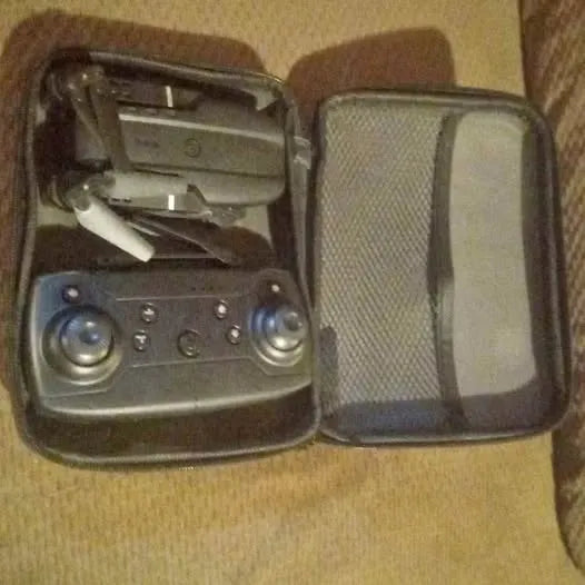 Drone transmitter with control panel in open hard case