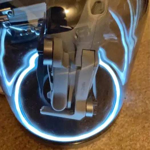 Drone charger dock with charging port and cable, in dark protective case