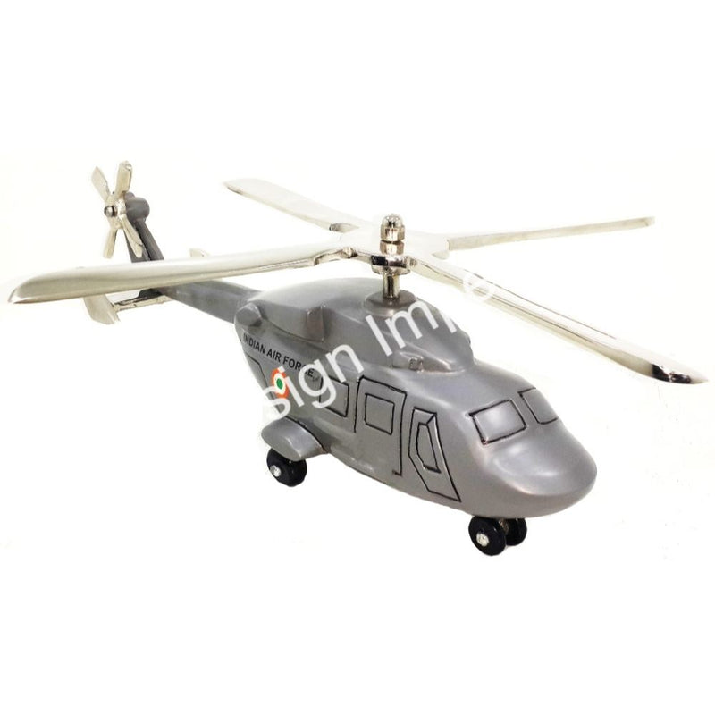 Grey cast helicopter model with white blades and landing gear, collectible souvenir