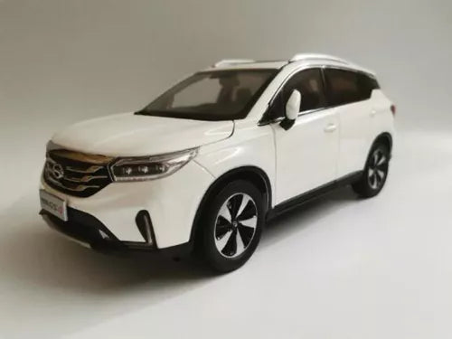 White diecast SUV model car with black wheels, front three-quarter view