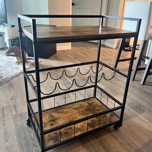 Black metal 3-tier shelf cart with open frame and wheels