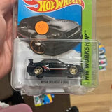 Hot Wheels diecast car in blister pack, black sports car with gold wheels