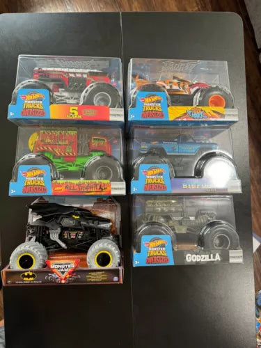 1/24 Monster Jam Hot Wheels diecast truck set in retail display boxes