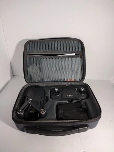 Foldable remote control camera drone in black hard case with protective mesh lid