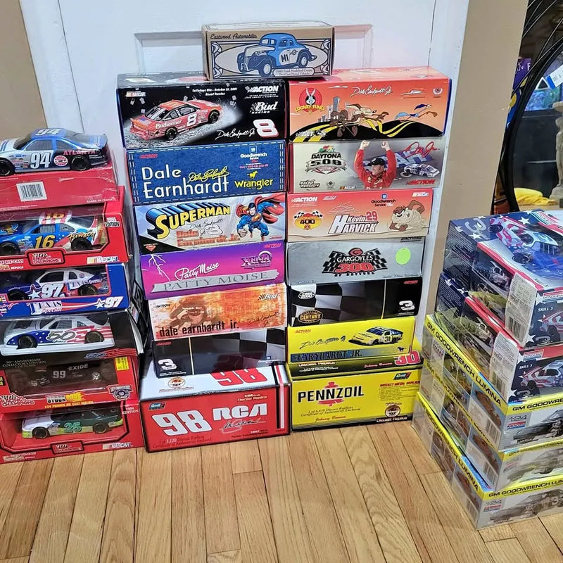 Boxed diecast race car collection with various numbered cars and logos