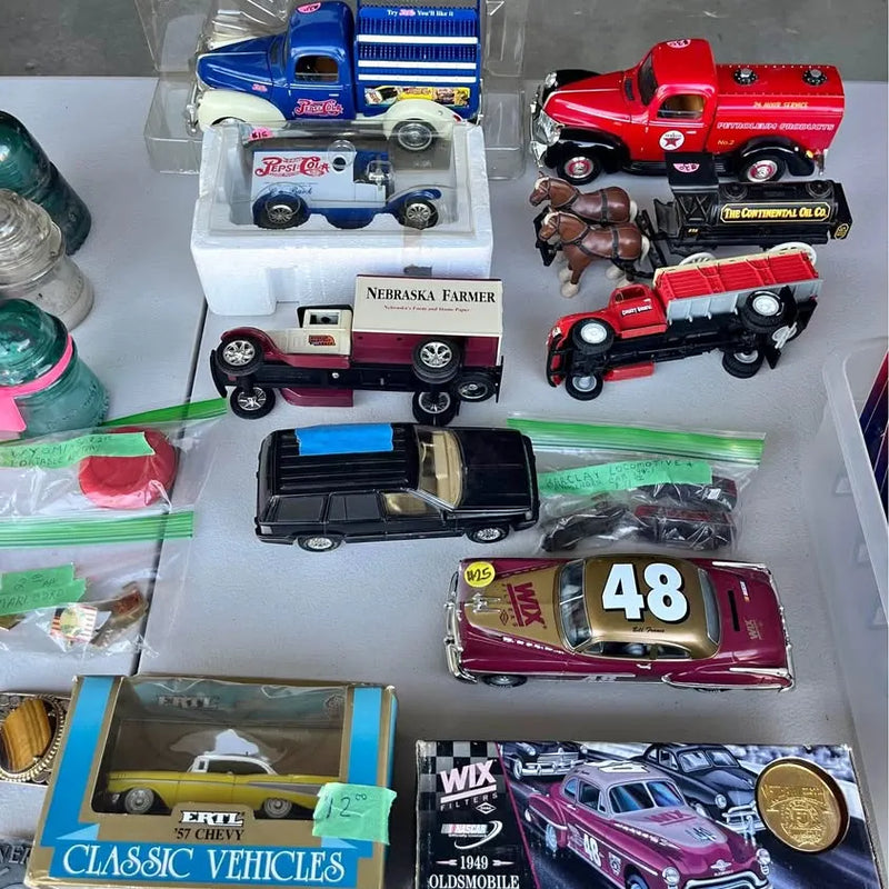 Die-cast vehicle set with trucks, race car, and classic vehicles in display box