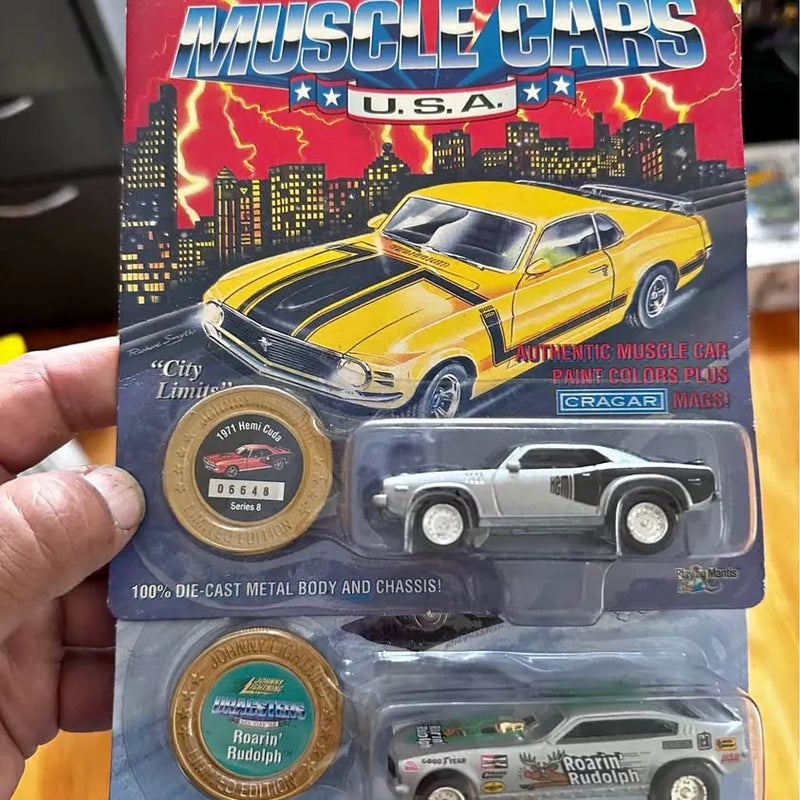 Diecast car blister pack with yellow and dark muscle cars on card