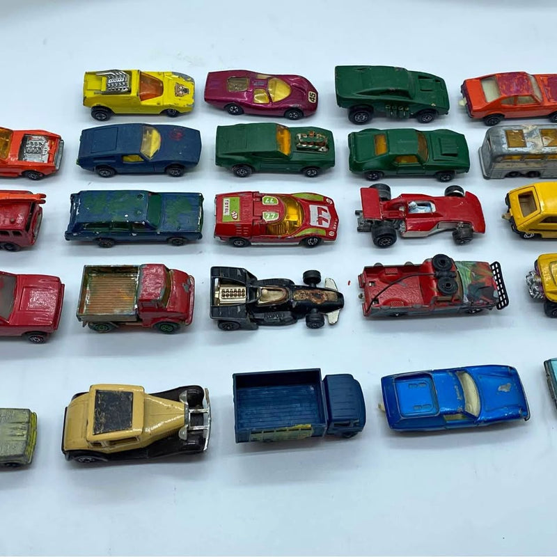 Assorted diecast toy car lot with multiple painted vehicles, mixed colors