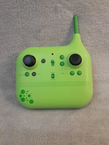Green remote control transmitter with two joysticks and antenna for stunt drone