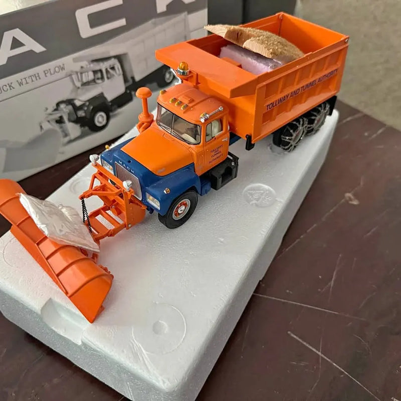 Orange and blue diecast construction truck with front blade and dump bed