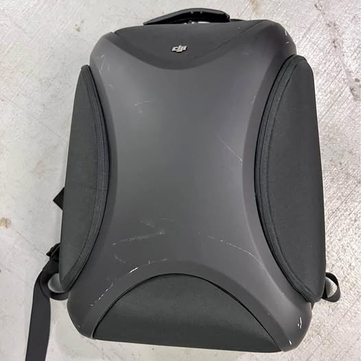 Gray padded DJI Phantom 4 Pro drone carrying case with side pockets