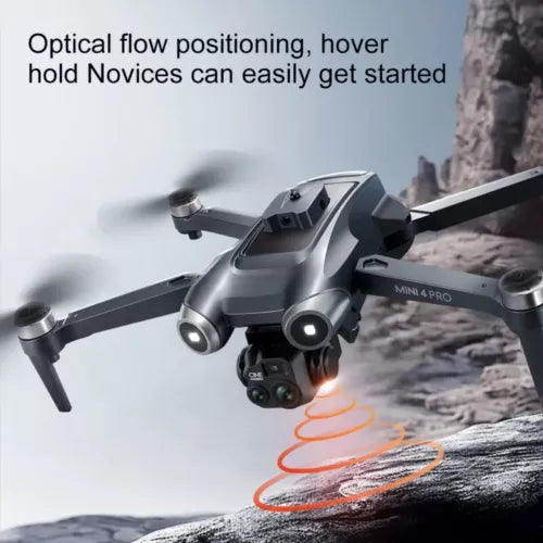 Compact grey quadcopter drone with forward camera gimbal and landing light
