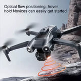 Compact grey quadcopter drone with forward camera gimbal and landing light
