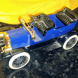 1/24 Scale John Deere diecast car with blue body, black seats, white wheels