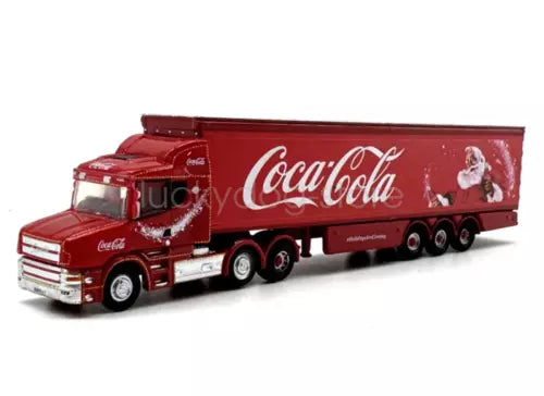 Red diecast delivery truck model with Coca-Cola holiday trailer and long semi cab