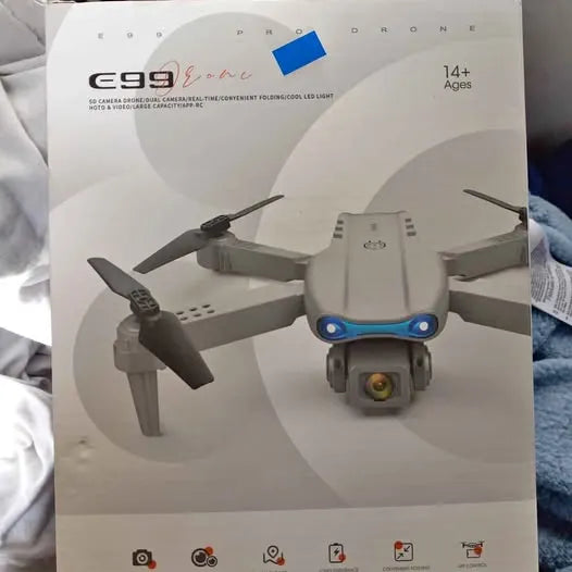 Foldable e99 drone with gray body and blue LED lights, front view on box