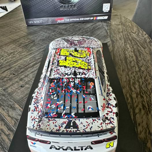 NASCAR diecast stock car with #24 Axalta branding and colorful confetti paint