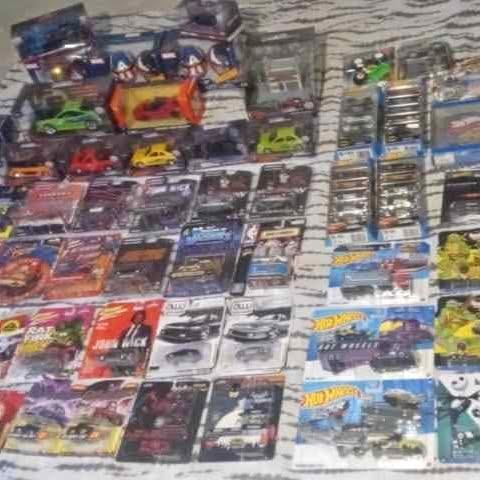 Diecast car toy collection in assorted boxed models, many colors and styles