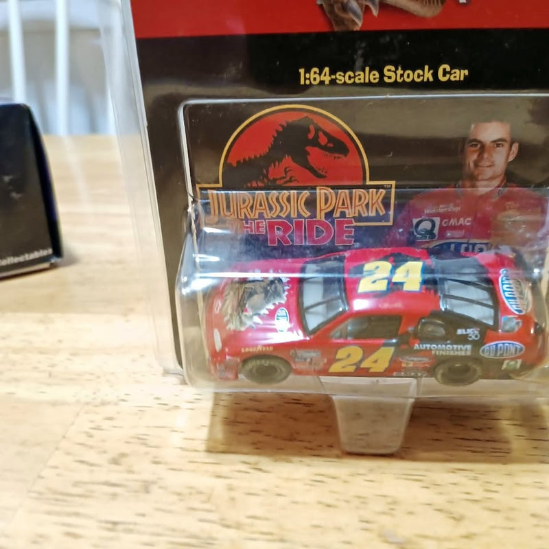 1:64 diecast race car in clear box, red #24 with Jurassic Park Ride graphics