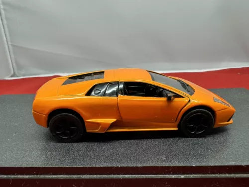 Orange diecast sports car toy model, side view, 1:36 scale