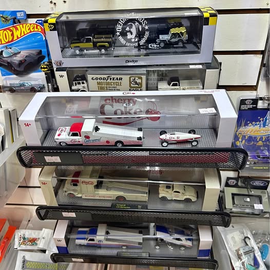 Die-cast model vehicle set in clear box, with car and truck replicas visible