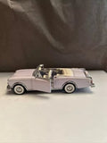 Franklin Mint 1/43 scale diecast convertible model car, light pink, side view