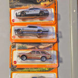 Diecast car blister pack with three Matchbox-style vehicles, multicolor detailing