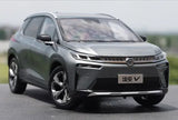 Green and gray diecast car model in front 3/4 view, black grille and lights