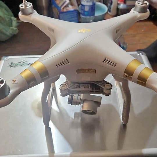DJI Phantom 3 4K drone with front camera gimbal and gold motor rings