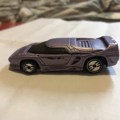 Purple vintage diecast car with black wheels and side graphics