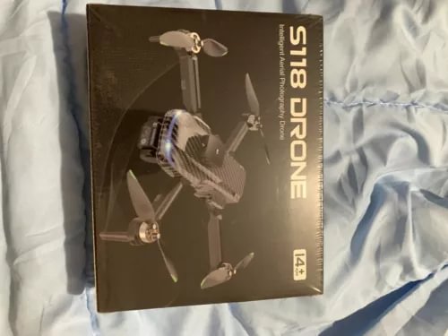 Drone retail box with quadcopter illustration and propellers, dark