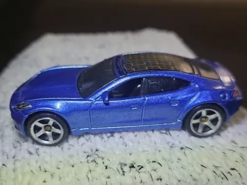 Fisker Karma 2010 diecast car, blue sedan with silver wheels and black windows