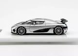 Silver 1:64 sports diecast car model with black accents, side view