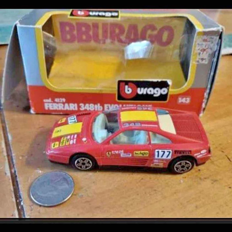 Red Ferrari diecast race car with number 177 decals, front view