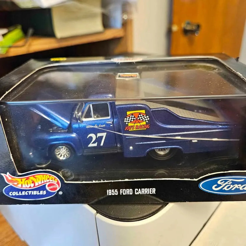 Dark blue diecast Ford Carrier truck #27 in retail display box with clear top