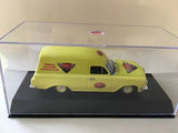 Yellow diecast car model with red decals, in clear display case on black base
