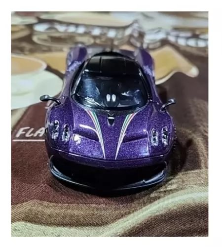 Purple alloy racing car model diecast, front view with black grille and headlights