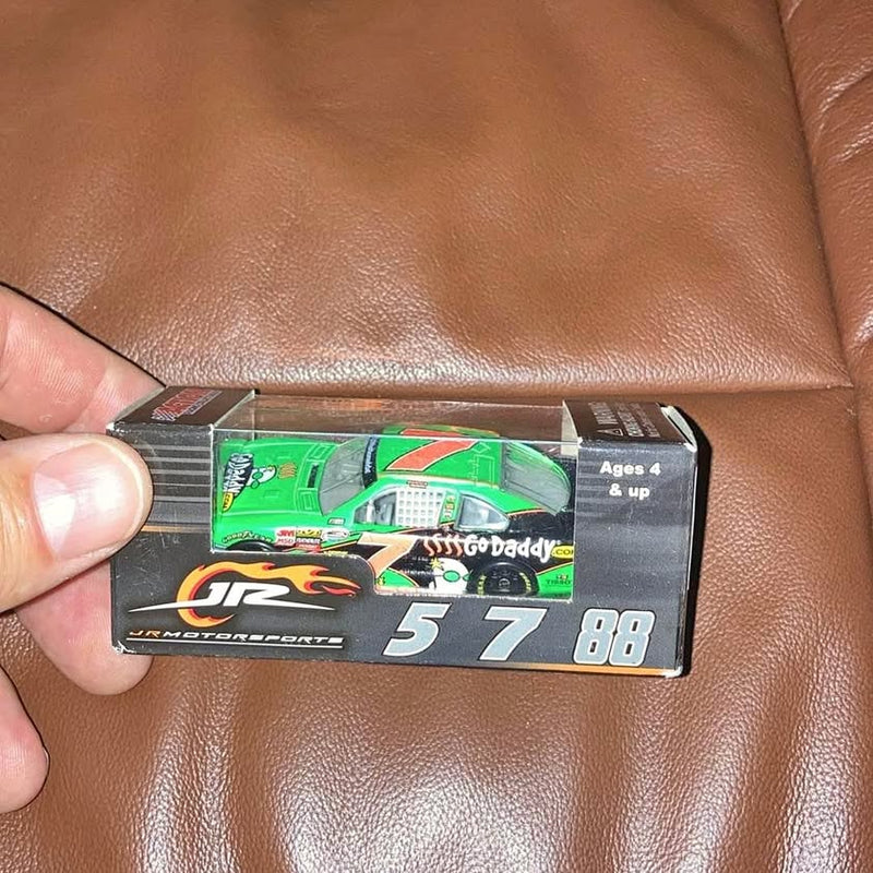1:64 diecast race car in box with green and white #5 sponsor graphics