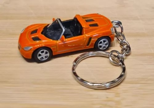 Orange 1/72 diecast model car keychain with metal keyring and chain links