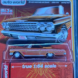 Blue diecast low rider car, front view with chrome grille and headlights