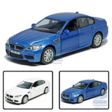 Blue BMW M5 diecast model car, pull-back toy sedan with front three-quarter view