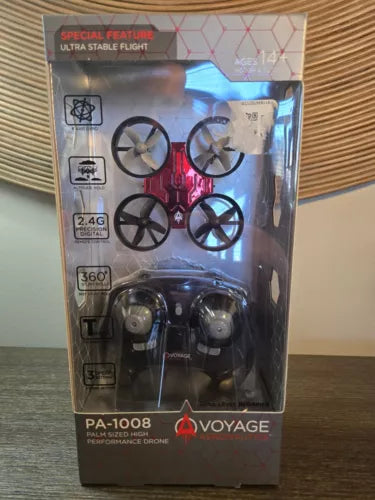 Micro drone with remote, palm-sized, shown in retail box with propellers